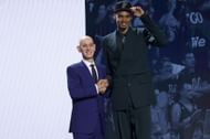 Victor Wembanyama (R) poses with NBA commissioner Adam Silver (L) after being drafted first overall pick by the San Antonio Spurs in the 2023 NBA draft